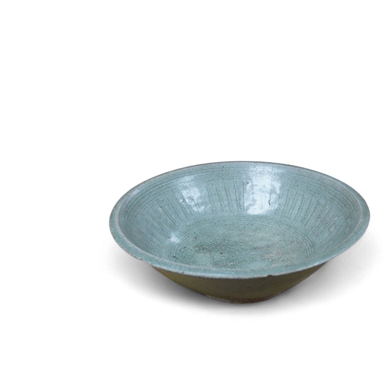 A Vietnamese glazed bowl with incised decoration, 23cm in diameter